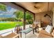 Covered patio with seating, fire pit, and views of the pool at 17918 N 95Th St, Scottsdale, AZ 85255