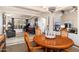 Elegant dining room with a large round table and comfortable seating at 17918 N 95Th St, Scottsdale, AZ 85255