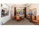 Bright dining room with a wooden table and access to the backyard at 17918 N 95Th St, Scottsdale, AZ 85255