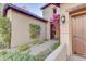 Welcoming entryway with a charming wooden door and beautiful landscaping at 17918 N 95Th St, Scottsdale, AZ 85255