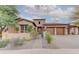 Stunning Spanish-style home with attractive landscaping and a gated entry at 17918 N 95Th St, Scottsdale, AZ 85255