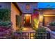 Inviting front entry with stone accents and landscaping at 17918 N 95Th St, Scottsdale, AZ 85255