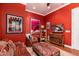 Relaxing game room featuring leather sofa, ottoman, and wine rack at 17918 N 95Th St, Scottsdale, AZ 85255