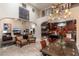 Open concept kitchen and living area with high ceilings and a fireplace at 17918 N 95Th St, Scottsdale, AZ 85255