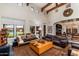 Living room with comfortable seating and views of the backyard at 17918 N 95Th St, Scottsdale, AZ 85255