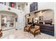 Spacious living room featuring comfortable seating and a fireplace at 17918 N 95Th St, Scottsdale, AZ 85255