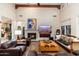 Relaxing living room with fireplace and large TV at 17918 N 95Th St, Scottsdale, AZ 85255