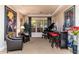 Living area with a grand piano, bar, and comfortable seating at 17918 N 95Th St, Scottsdale, AZ 85255