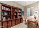 Home office with built-in bookcase and writing desk at 17918 N 95Th St, Scottsdale, AZ 85255
