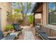 Spacious patio with seating and dining areas, lush landscaping at 17918 N 95Th St, Scottsdale, AZ 85255