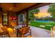 Outdoor patio with seating and a stunning sunset view at 17918 N 95Th St, Scottsdale, AZ 85255