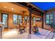 Relaxing outdoor patio with seating area, fire pit, and built-in grill at 17918 N 95Th St, Scottsdale, AZ 85255