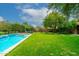 Relaxing pool area with a tranquil water feature and lush greenery at 17918 N 95Th St, Scottsdale, AZ 85255
