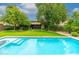 Inviting rectangular pool with steps and a large grassy area at 17918 N 95Th St, Scottsdale, AZ 85255