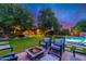 Inviting pool and patio area with fire pit and comfortable seating at 17918 N 95Th St, Scottsdale, AZ 85255