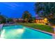 Luxury pool with a waterfall feature at dusk at 17918 N 95Th St, Scottsdale, AZ 85255