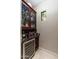 Wet bar with wine rack, beverage cooler, and glass shelving at 17918 N 95Th St, Scottsdale, AZ 85255