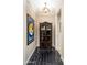 Elegant wine cellar with dark wood shelving and flooring at 17918 N 95Th St, Scottsdale, AZ 85255