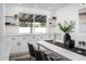 Elegant dining area with white cabinetry and a long dining table at 2074 E Dunbar Dr, Tempe, AZ 85282