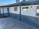 Covered patio with gray concrete flooring and surrounding yard at 2074 E Dunbar Dr, Tempe, AZ 85282