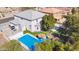 Aerial view showcasing a backyard oasis with a sparkling pool and lush greenery at 2161 E Flintlock Way, Chandler, AZ 85286