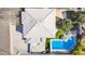 Aerial view of a home with backyard pool, a green lawn, and three car garage at 2161 E Flintlock Way, Chandler, AZ 85286