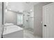 Elegant bathroom with glass-enclosed shower, dual sinks, and tiled flooring for a spa-like experience at 2161 E Flintlock Way, Chandler, AZ 85286