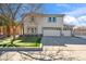 Charming two-story home with a well-manicured lawn and a three car garage at 2161 E Flintlock Way, Chandler, AZ 85286