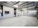 Spacious garage with epoxy flooring, storage racks and lighting at 2161 E Flintlock Way, Chandler, AZ 85286