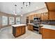 Beautiful kitchen with a large island, stainless steel appliances, and custom wood cabinets at 2161 E Flintlock Way, Chandler, AZ 85286