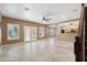 Open-concept living area with tile floors and natural light from the sliding glass doors at 2161 E Flintlock Way, Chandler, AZ 85286