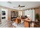 Office space with plank floors, large desk, sliding barn door and stylish decor at 2161 E Flintlock Way, Chandler, AZ 85286
