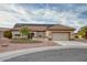 House exterior showcasing solar panels, landscaping and a two-car garage at 21626 N 157Th Dr, Sun City West, AZ 85375