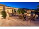 Evening view of patio with fire pit and seating at 21935 N San Ramon Dr, Sun City West, AZ 85375