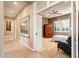 Guest bedroom with a cozy sitting area and built in cabinet at 21935 N San Ramon Dr, Sun City West, AZ 85375