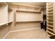 Large walk-in closet with ample shelving and hanging space at 21935 N San Ramon Dr, Sun City West, AZ 85375