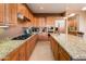 Kitchen with stainless steel appliances and granite countertops at 21935 N San Ramon Dr, Sun City West, AZ 85375