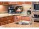 Kitchen with granite countertop and stainless steel sink at 21935 N San Ramon Dr, Sun City West, AZ 85375