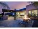 Backyard with fire pit and outdoor kitchen area at 23311 N 95Th Dr, Peoria, AZ 85383