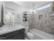 Modern bathroom with a soaking tub, tiled shower, and floating vanity at 23311 N 95Th Dr, Peoria, AZ 85383