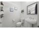 Clean and modern half bathroom with pedestal sink at 23311 N 95Th Dr, Peoria, AZ 85383
