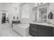 Elegant bathroom with double vanity and soaking tub at 23311 N 95Th Dr, Peoria, AZ 85383