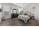 Bedroom with a Parisian-themed comforter and dark wood dresser at 23311 N 95Th Dr, Peoria, AZ 85383