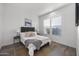 Bright bedroom with a comfortable bed and ample natural light at 23311 N 95Th Dr, Peoria, AZ 85383