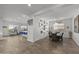 Open concept dining room with a rustic farmhouse table and gallery wall at 23311 N 95Th Dr, Peoria, AZ 85383