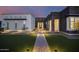 Welcoming front entry with a stone walkway and landscape lighting at 23311 N 95Th Dr, Peoria, AZ 85383