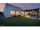 Home exterior showcasing backyard oasis with a pergola and outdoor kitchen at 23311 N 95Th Dr, Peoria, AZ 85383