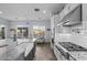 Modern kitchen with white cabinets, granite countertops and stainless steel appliances at 23311 N 95Th Dr, Peoria, AZ 85383