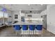 Modern kitchen featuring a large island with seating and stainless steel appliances at 23311 N 95Th Dr, Peoria, AZ 85383