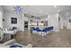 Island kitchen with blue velvet seating, stainless steel appliances, and ample counter space at 23311 N 95Th Dr, Peoria, AZ 85383